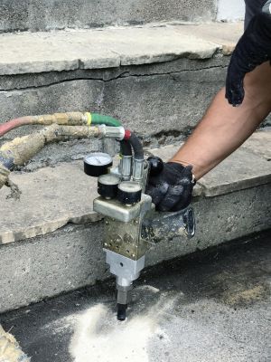 Professional technician applying leveling material